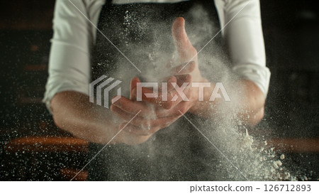 Freeze Motion Chef Clapping Hands with Flour . Closeup of Bread or Pizza Dough Preparation 126712893