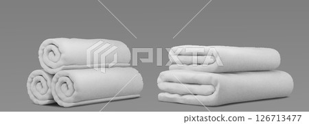 Folded white spa towel linens on gray background 126713477
