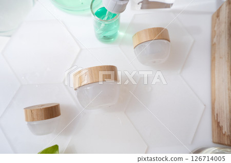 Laboratory tested cream in white glass container 126714005