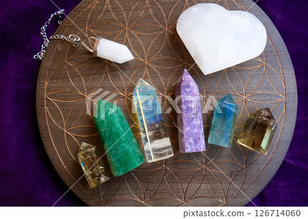 Healing crystals on brown background Healing crystals on brown background 126714060