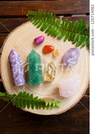 Healing crystals on brown background 126714062