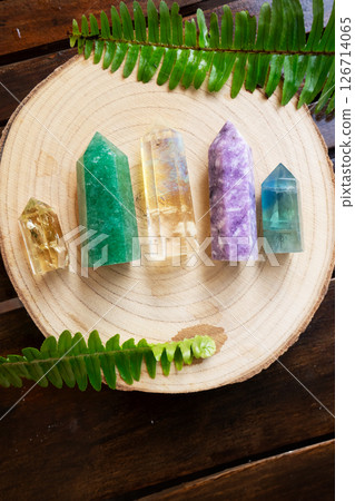 Healing crystals on brown background 126714065