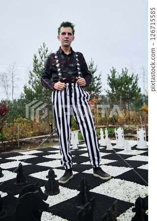 Edgy Fashion Set Against a Chessboard Landscape A Unique and Bold Style Statement 126715585