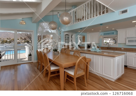 Cozy Kitchen with a View: A Serene Dining Area Overlooking a Tranquil Lake 126716068
