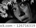 Black-and-White Portrait of a Woman with Daisies in Her Hair 126716319