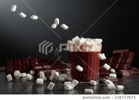 Hot chocolate with mini marshmallow in a glass mug. 126717673