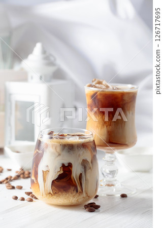 Iced coffee with cream and natural ice. 126717695