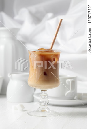 Iced coffee with cream and cup of black coffee. Iced coffee with cream and cup of black coffee. 126717705
