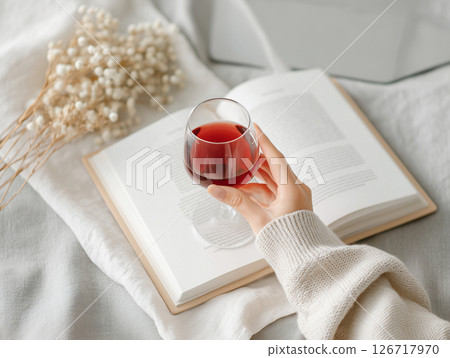 Stylish holiday reading and wine time Stylish holiday reading and wine time 126717970