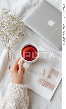 Reading and tea surrounded by soft light Reading and tea surrounded by soft light 126717971