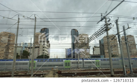 Naples' modern skyscrapers from the city's station on a gray, cloudy day. Naples' modern skyscrapers from the city's station on a gray, cloudy day. 126718313