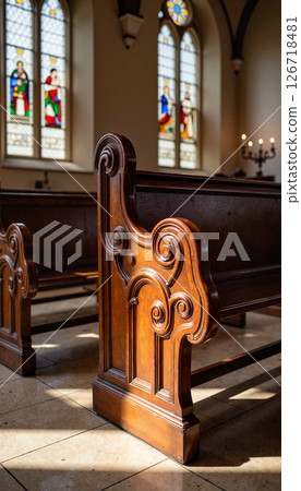 Intricately carved wooden church pew in historic interior, architectural beauty 126718481