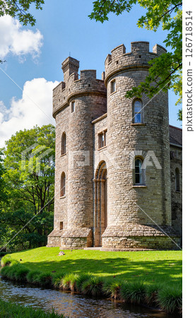 Intricately detailed medieval castle beside gentle river, tranquility 126718514