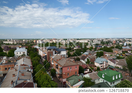 Aerial view of the city of Vinnytsia. Ukraine. Travel across Europe. Roofs of houses, roads, cars, trees with green leaves. Aerial view of the city of Vinnytsia. Ukraine. Travel across Europe. Roofs of houses, roads, cars, trees with green leaves. 126718870
