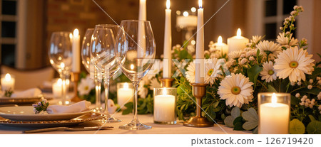 Romantic candlelit dinner table setting with elegant flowers, wedding ambiance 126719420