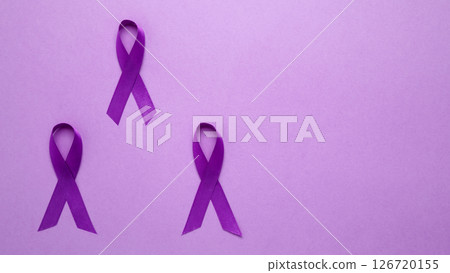 Purple ribbon held, symbol of support. Purple Epilepsy Awareness Day Purple ribbon held, symbol of support. Purple Epilepsy Awareness Day 126720155