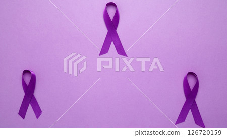 Purple ribbon held, symbol of support. Purple Epilepsy Awareness Day Purple ribbon held, symbol of support. Purple Epilepsy Awareness Day 126720159