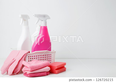 Cleaning supplies in a container, ready for a productive and satisfying spring refresh. Household cleaning and hygiene concept concept 126720215
