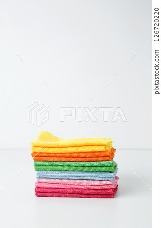 Colorful cleaning cloths neatly arranged, bringing brightness and energy to spring chores. Household cleaning and hygiene concept concept 126720220
