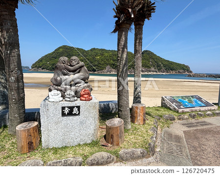 Stone statue of a monkey and the blue sea of Koshima Stone statue of a monkey and the blue sea of Koshima 126720475