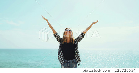 Summer vacation, happy cheerful young woman laughing having fun on beach on sea coast background 126720534