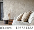 Limewash textured wall adding depth and organic uniqueness to modern interior design 126721382
