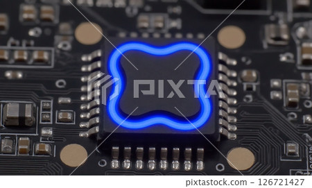 A close up shot of a modern computer chip with a blue outline on a dark circuit board A close up shot of a modern computer chip with a blue outline on a dark circuit board 126721427