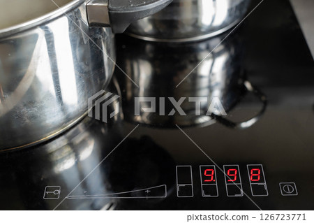 Discover the Modern Induction Cooktop that comes with Pots and features a Digital Display 126723771