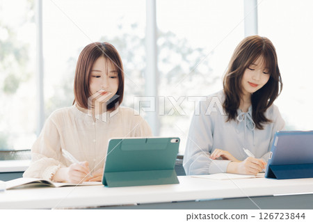 College students using tablets in class College students using tablets in class 126723844