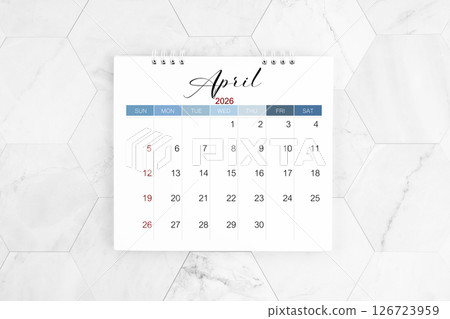 April 2026 blank desk calendar on marble table, Flat lay. April 2026 blank desk calendar on marble table, Flat lay. 126723959