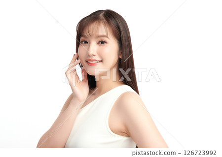 A beautiful young Asian woman with clean, fresh skin against a white background. Skincare, facial treatment, cosmetology, beauty, and spa. An elegant portrait of an Asian woman. A beautiful young Asian woman with clean, fresh skin against a white background. Skincare, facial treatment, cosmetology, beauty, and spa. An elegant portrait of an Asian woman. 126723992