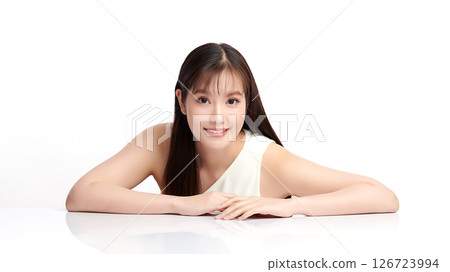 A beautiful young Asian woman with clean, fresh skin against a white background. Skincare, facial treatment, cosmetology, beauty, and spa. An elegant portrait of an Asian woman. A beautiful young Asian woman with clean, fresh skin against a white background. Skincare, facial treatment, cosmetology, beauty, and spa. An elegant portrait of an Asian woman. 126723994