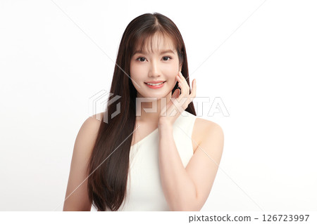 A beautiful young Asian woman with clean, fresh skin against a white background. Skincare, facial treatment, cosmetology, beauty, and spa. An elegant portrait of an Asian woman. A beautiful young Asian woman with clean, fresh skin against a white background. Skincare, facial treatment, cosmetology, beauty, and spa. An elegant portrait of an Asian woman. 126723997
