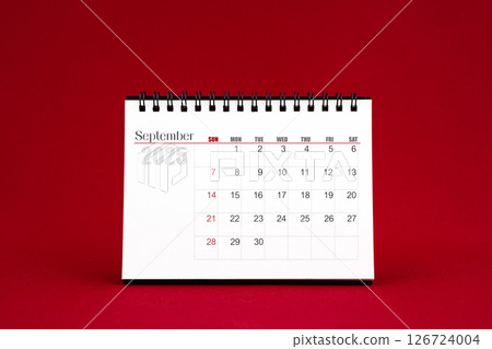 September 2025 Blank desk calendar on red background. September 2025 Blank desk calendar on red background. 126724004