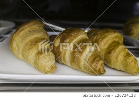 Artisanal chocolate croissant 126724128