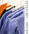 Colored t-shirts on hangers 126724132