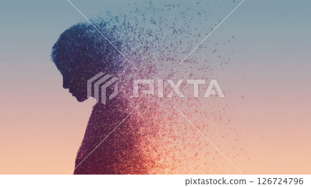 Silhouette of a Dissolving Person Against a Vibrant Gradient Background 126724796