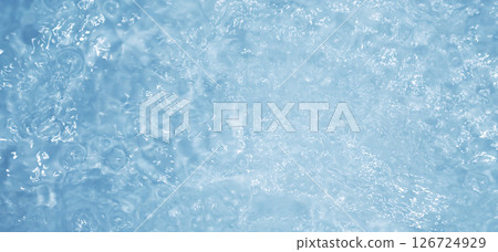 Blue water with ripples. Defocus blurred bleu clear calm water surface texture with splashes and bubbles. 126724929