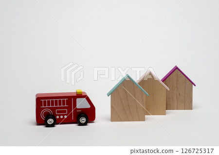 A fire engine rushed to the house A fire engine rushed to the house 126725317