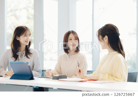 College students doing group work 126725667