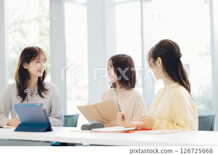 College students doing group work 126725668