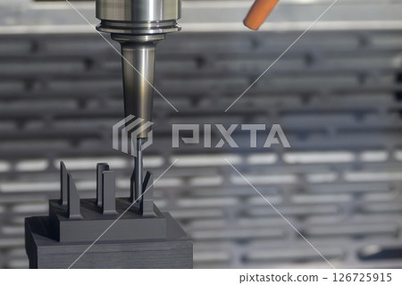 The CNC milling machine finish cut the graphite electrode parts with solid ball nose end mill tool. 126725915