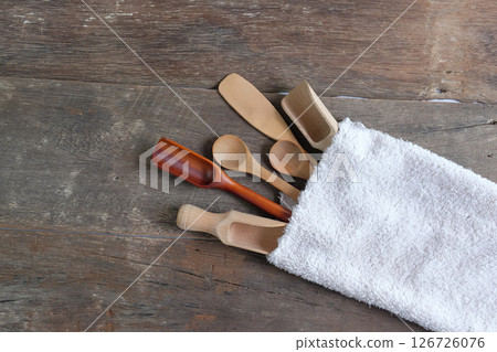 Set of wooden spoons are different kinds in towel on wooden. Set of wooden spoons are different kinds in towel on wooden. 126726076