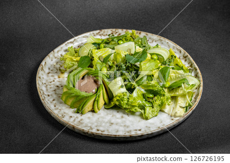 Salad with chickpeas, feta and avocado. healthy food.  126726195