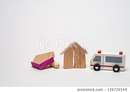 A collapsed building and an ambulance rushing to the scene A collapsed building and an ambulance rushing to the scene 126726549