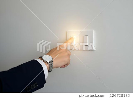 Hand Turning on Light Switch 126728183