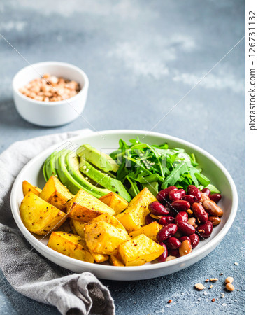 Healthy vegan meal with potatoes, avocado and beans Healthy vegan meal with potatoes, avocado and beans 126731132