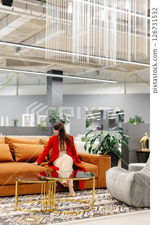 Interior designer choosing furniture in a showroom Interior designer choosing furniture in a showroom 126731532