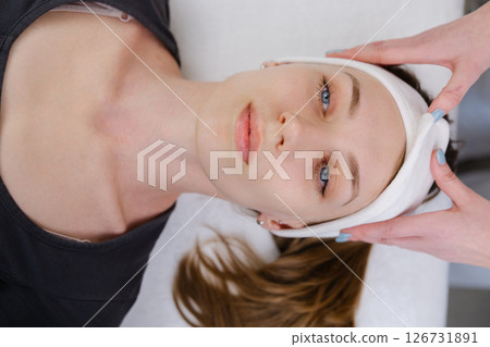 Professional Beautician Performing Facial Treatment in Spa 126731891