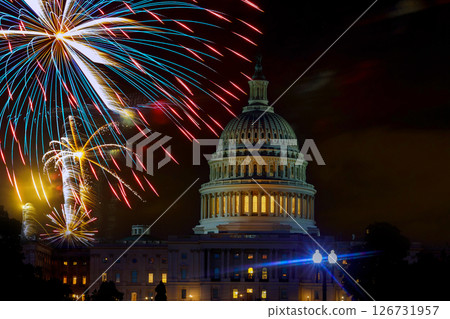 Fireworks burst above Capitol dome building during Fourth of July nighttime celebration in Washington D.C. 126731957